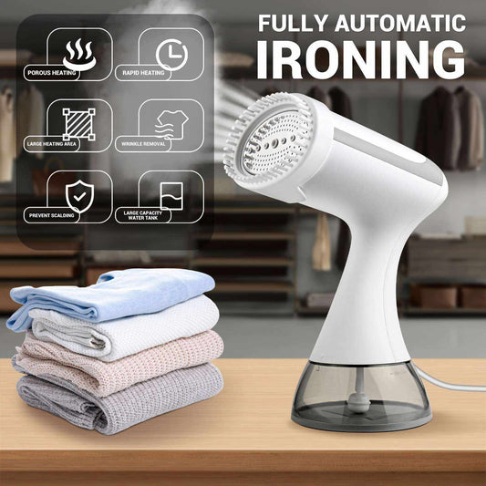 Compact white clothes steamer with water tank and folded clothes on wooden table for home and travel use