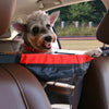 Pet supplies back seat cloth guardrail with red and black mesh holding small dog in car