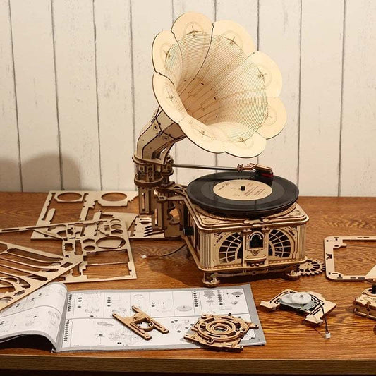 Robotime ROKR DIY wooden hand crank classic gramophone puzzle model with vinyl record and assembly instructions on table