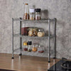 Three-tier silver mini home shelf with wire steel construction holding spice jars on kitchen countertop
