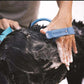 Blue pet bathing tool scrubbing and massaging a wet dog with soap suds