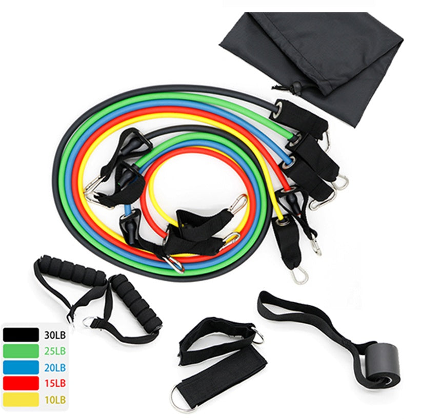 Set of colorful latex resistance bands with foam handles and accessories for yoga and fitness exercises