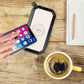 wireless solar powerbank charging smartphone on wooden table next to coffee cup and notebook