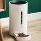 white smart pet feeder with digital display and food tray filled with pet kibble