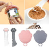 Multifunction pet canned spoon and jar opener with paw design, silicone material, includes spoon and lid for scooping and sealing pet food cans.