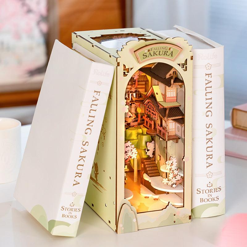 Robotime Rolife Book Nooks Falling Sakura DIY wooden miniature house with LED lighting between two decorative book covers