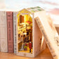 Robotime Rolife Book Nooks miniature wooden Sunshine Town DIY house furniture display between books on a shelf