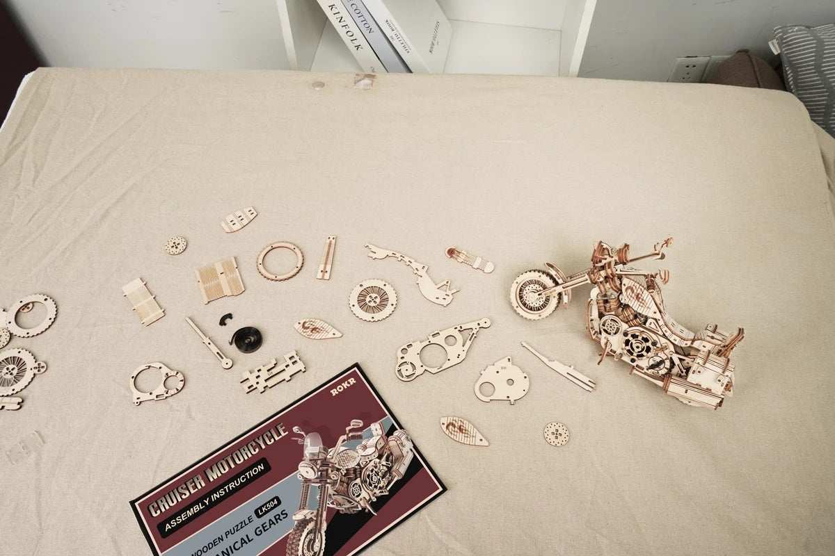 420 piece wooden building block kit with partially assembled cruiser motorcycle model and instruction booklet on beige surface