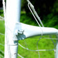Close-up of white powder-coated steel frame and net attachment on 8' x 5' soccer goal outdoors on green grass