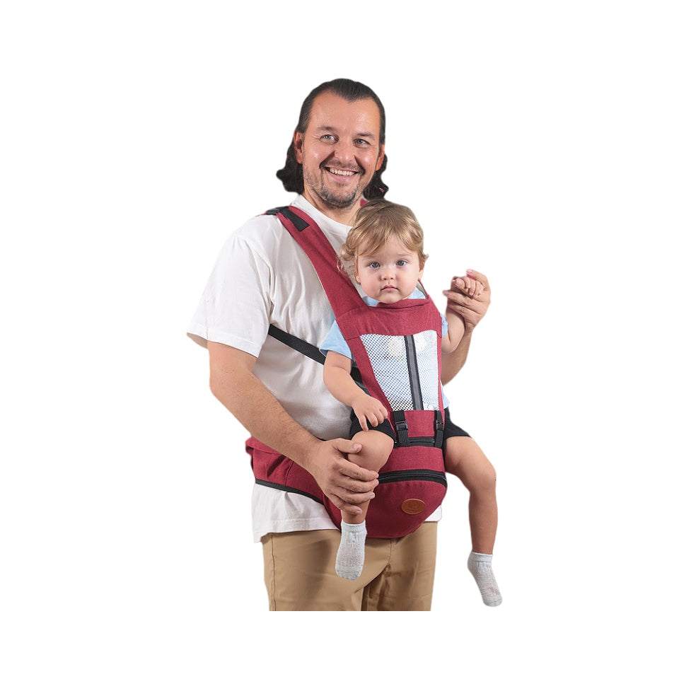 Man carrying toddler in red adjustable baby hip seat carrier with storage pocket and ergonomic design