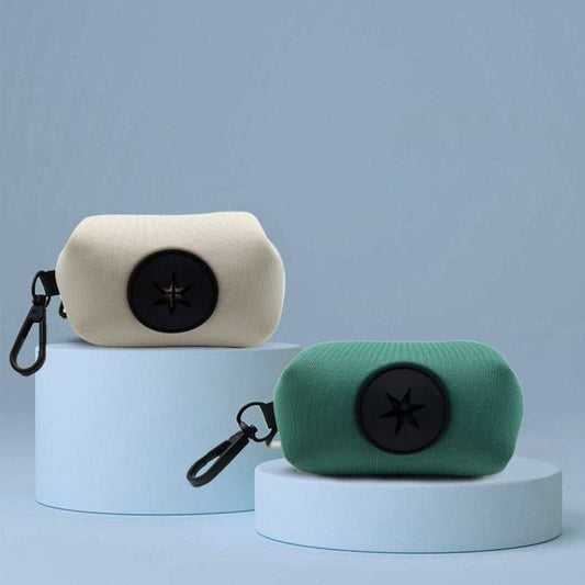 Pet supplies stool bag dispenser in white and green with clip for easy attachment