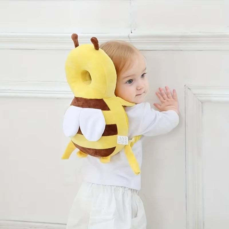 baby wearing yellow cartoon bee head back protector pillow for fall prevention and safety