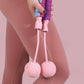 Adjustable weighted ropeless jump rope with pink handles and weighted balls for fitness workouts