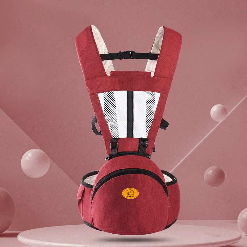 Red ergonomic baby hip seat carrier with adjustable straps and storage pockets for infants and toddlers
