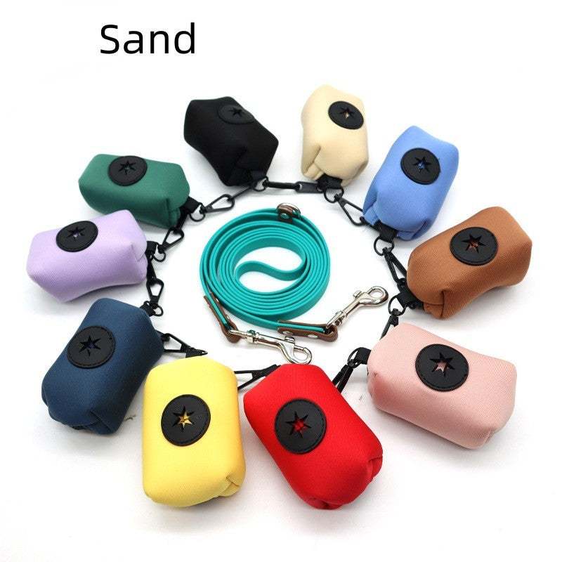 Colorful pet supplies stool bag dispensers made of diving fabric in various colors arranged in a circle with a blue leash in the center
