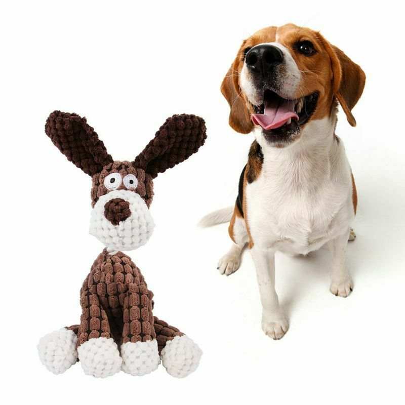 Dog playing with brown and white plush squeaky dog toy for chew and teeth cleaning