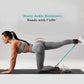 Woman using ankle strap resistance bands for leg and hip workout at home