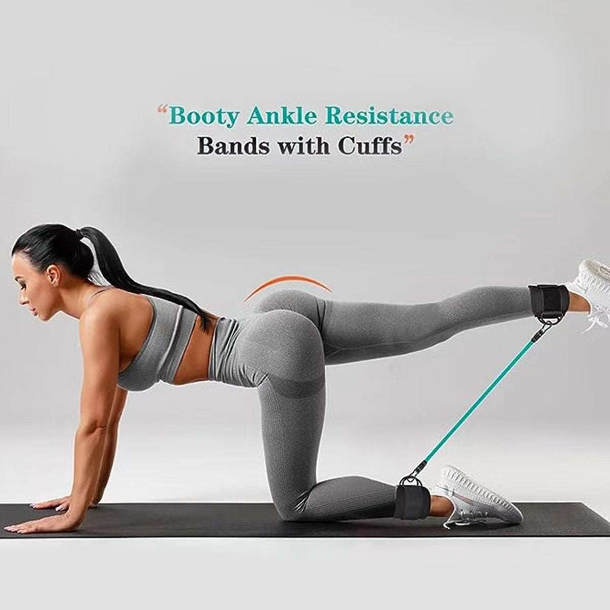 Woman using ankle strap resistance bands for leg and hip workout at home