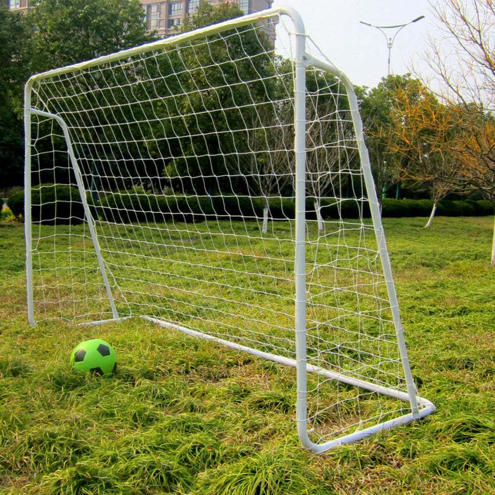 8' x 5' soccer goal with white powder-coated steel frame and nylon net on grass field with green and black soccer ball