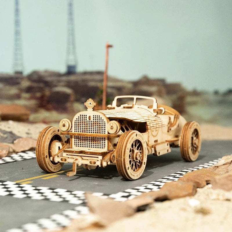3D wooden puzzle vintage racing car model assembled from laser-cut plywood parts on a miniature race track