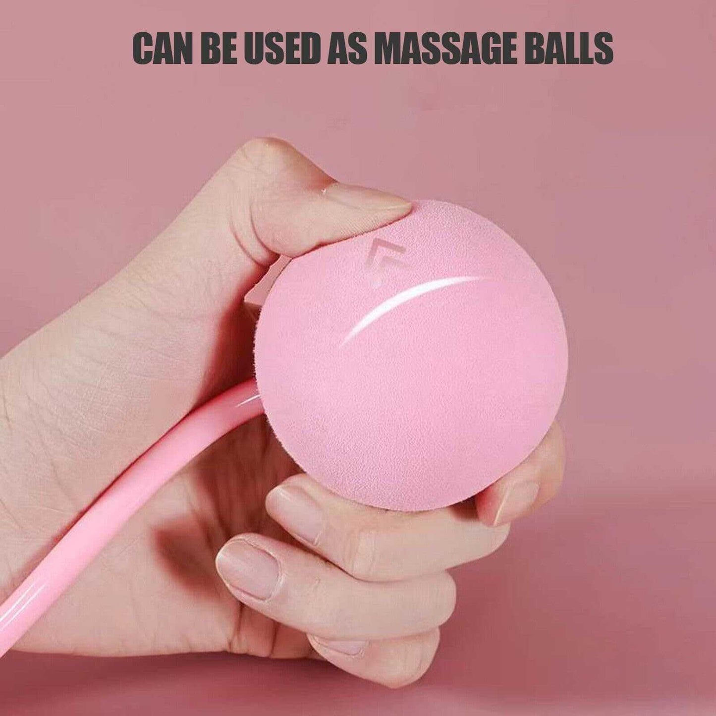 Hand holding pink weighted jump rope ball that can be used as massage balls