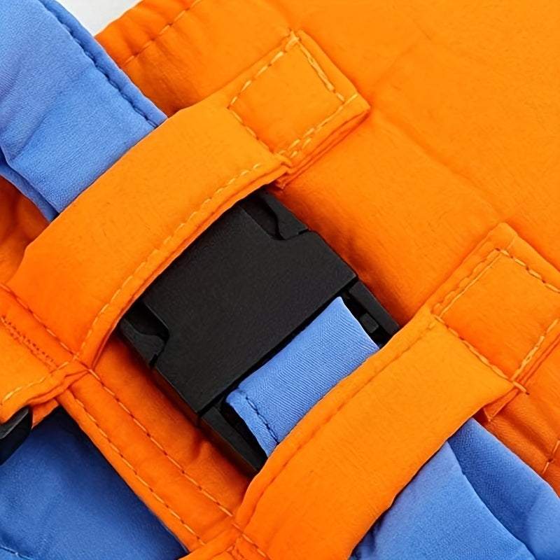 Close-up of orange and blue baby toddler harness safety buckle strap
